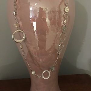 Long Silver necklace with matching earrings.